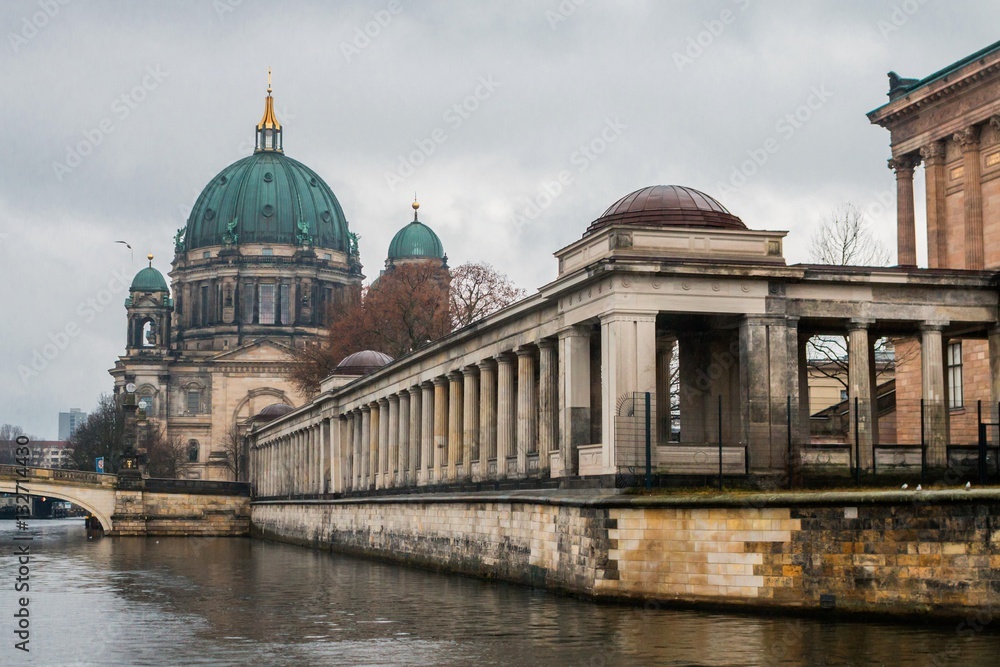 BERLIN, GERMANY - DECEMBER 22, 2016: Berlin Cathedral (Berliner Dom) and Museum Island (Museumsinsel) reflected in Spree River, Berlin, Germany. Vintage style