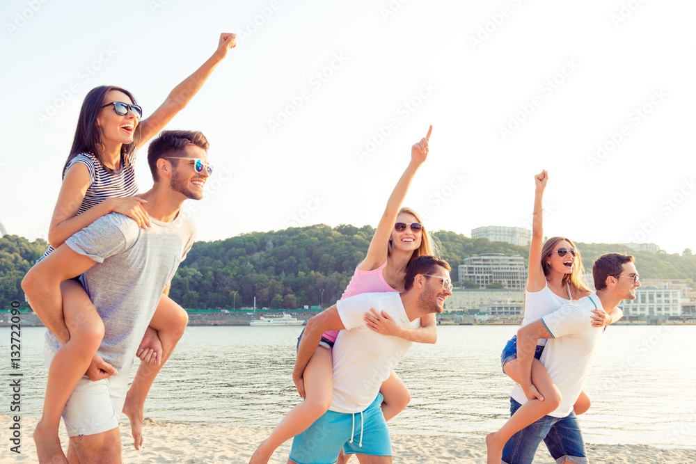 Group of happy young people having fun at the beach summer day Group of happy young people having fun at the beach summer day