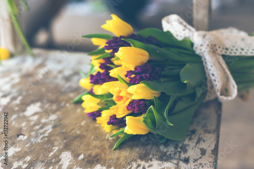 Yellow tulips and purple hyacinths flowers bouquet
