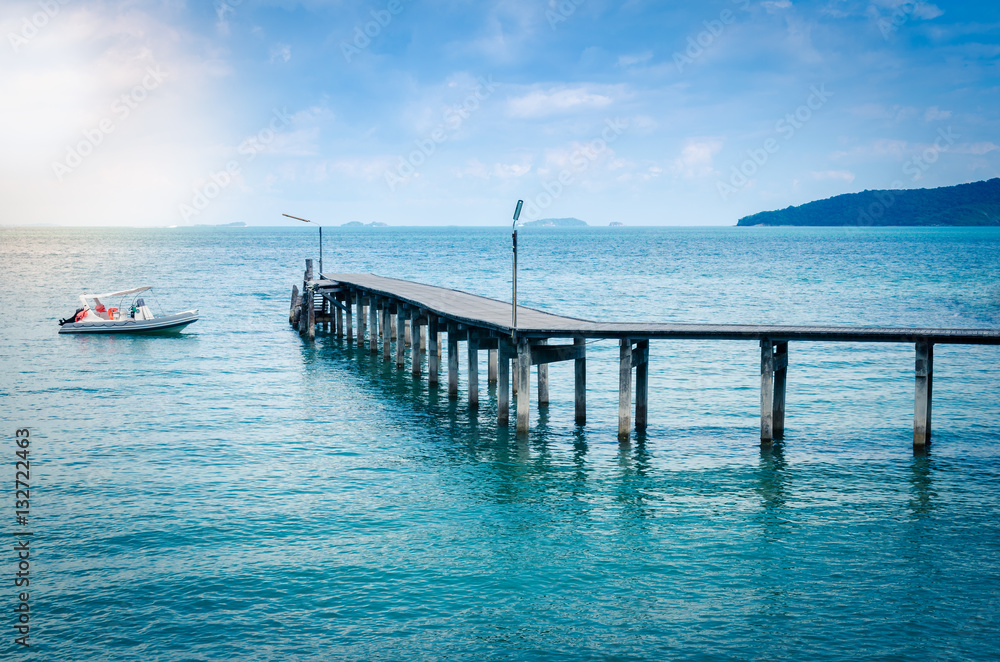 Fototapeta premium wooden jetty with boat