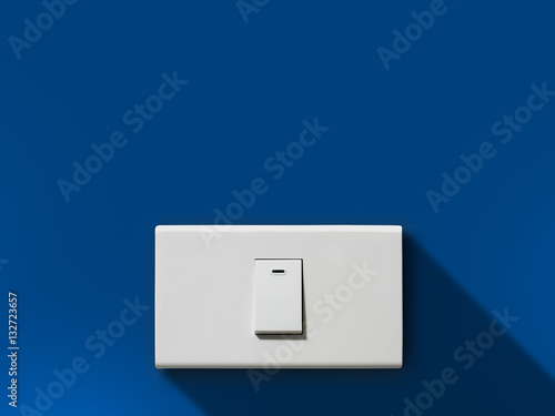 Single switch on blue wall. turn off to save energy.