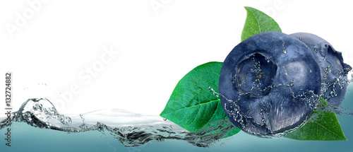 Fotografija Blueberries on a background of splashing water.