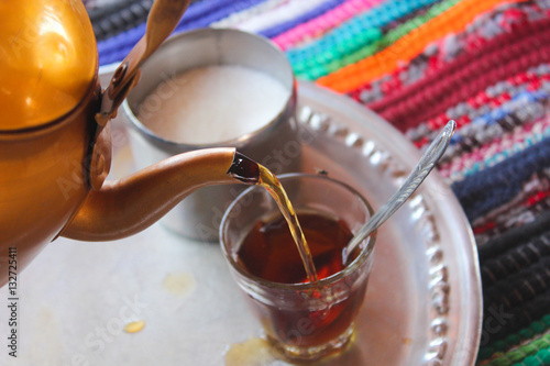 Bedouin tea / Featuring Bedouin Tea, Sugar and a colorful handmade backbag in a colorful Badawy tent /  photo