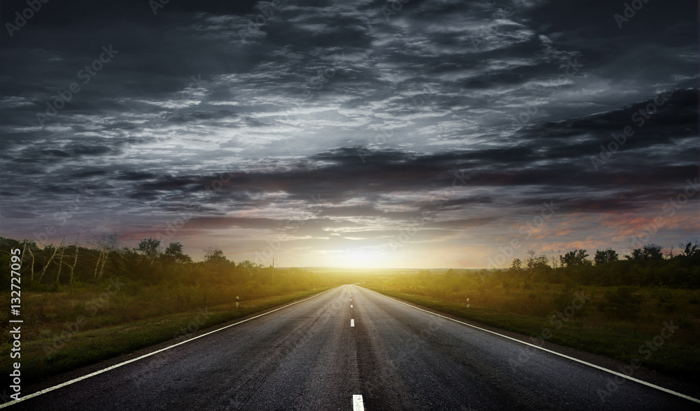 Naklejka premium Country road with a dark sky