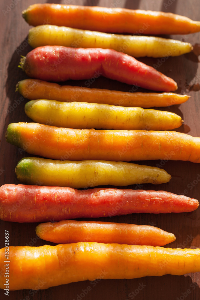 raw colorful carrot vegetable on wooden background raw colorful carrot vegetable on wooden background