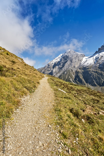 Mountain hiking trail in swiss alps