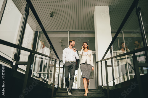 Business couple coming down...