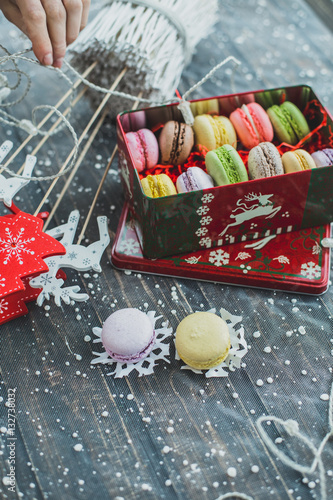 Christmas background with macaroons garlands and snow