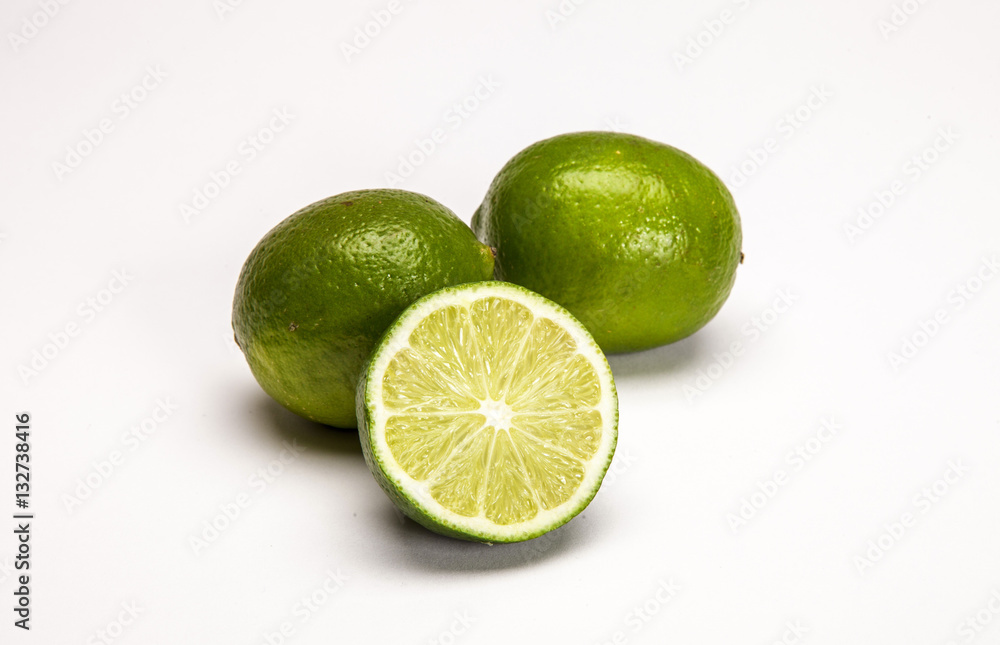 Whole fresh lemons and matches on white background Whole fresh lemons and matches on white background