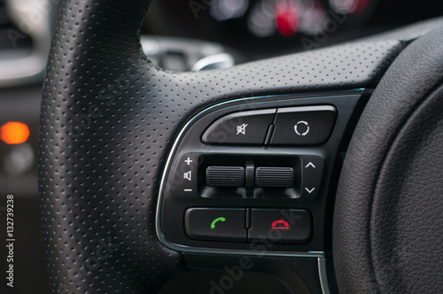 Call buttons on car steering wheel.