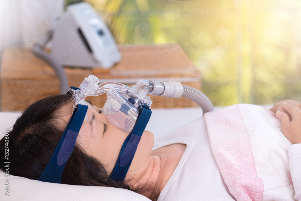 Fotka „Obstructive sleep apnea therapy, Woman wearing CPAP mask.CPAP