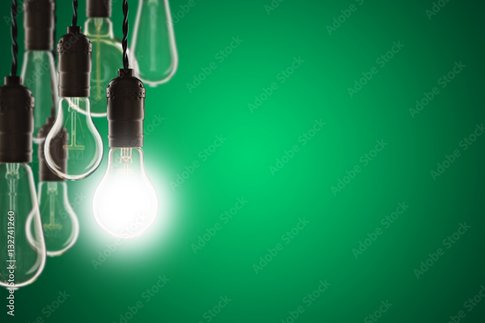 Idea and leadership concept - bulbs on the grunge background Idea and leadership concept - bulbs on the grunge background