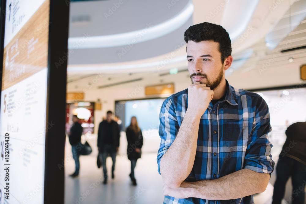 Young man in the shopping mall Young man in the shopping mall