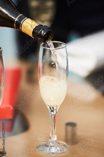bottle of champagne with glass