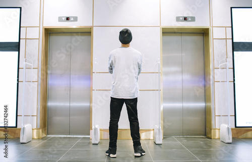 Man in hat standing near the elevator © alexshutter95