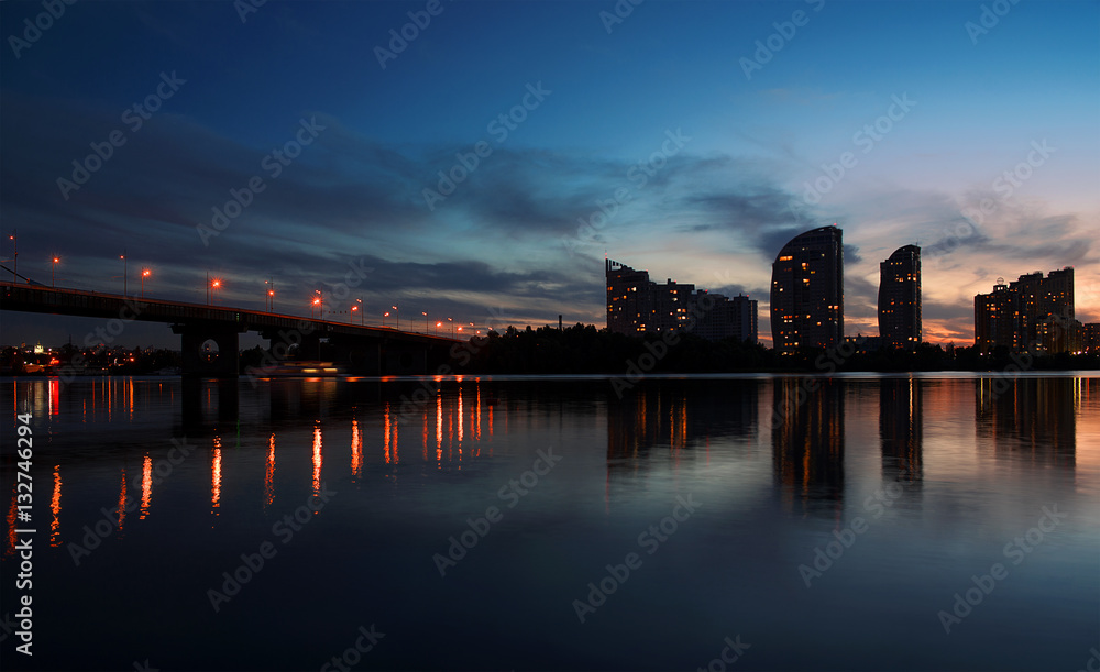 Cityscape: Moscow brindge and Obolon district in the evening. Kiev. Ukraine. East Europe