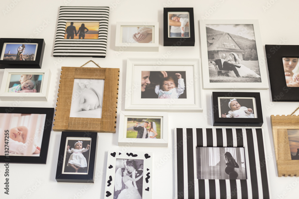 photos of the family in various photo frames - obrazy, fototapety, plakaty 