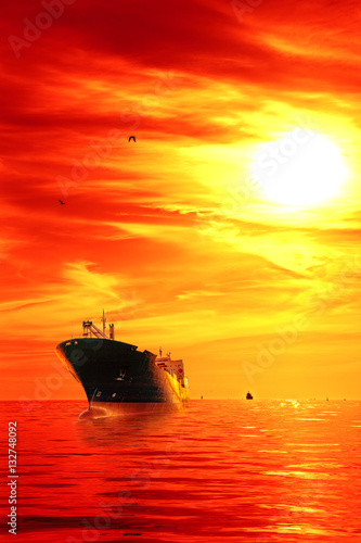 Silhouette of the tanker ship on red sunrise. © Nightman1965