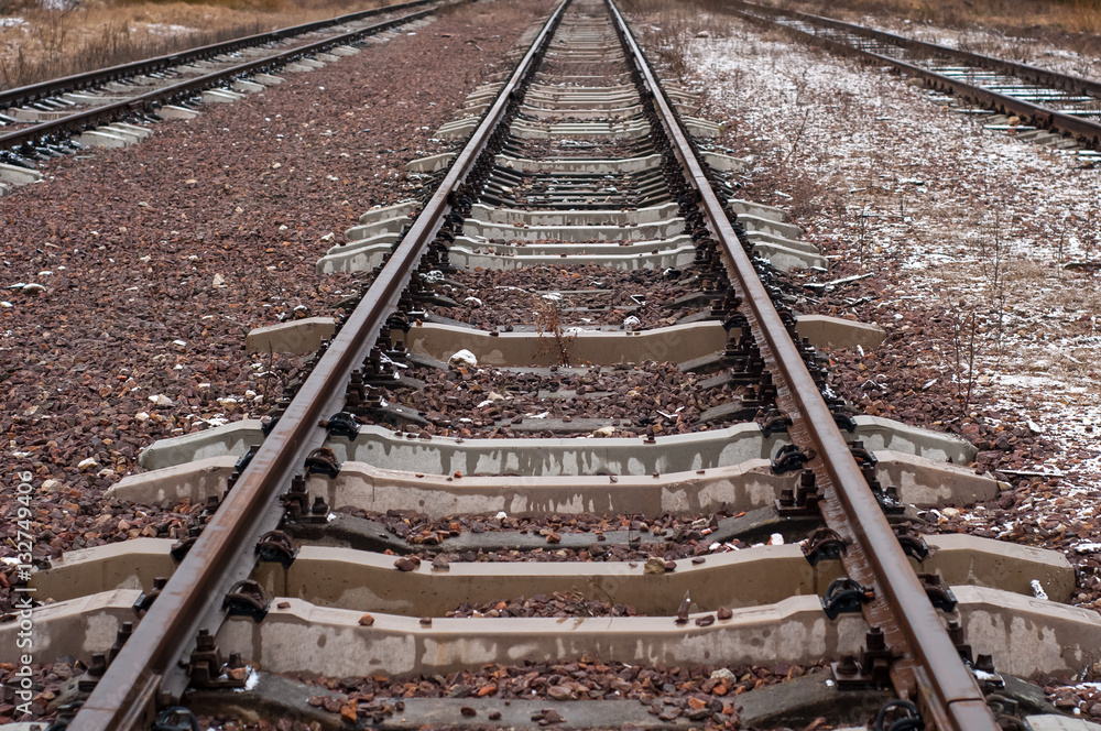 Straight railroad tracks.