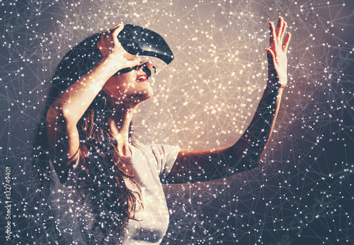 Quadro em tela Woman using a virtual reality headset