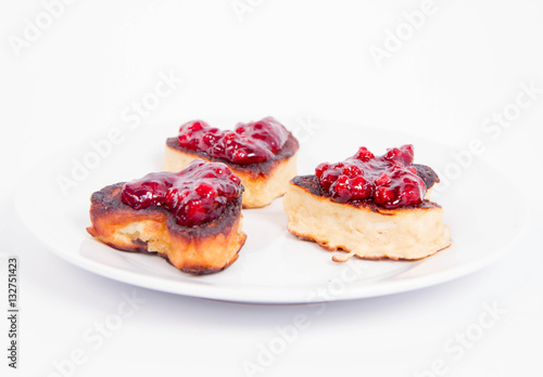 Heart shaped pancakes with cowberry jam