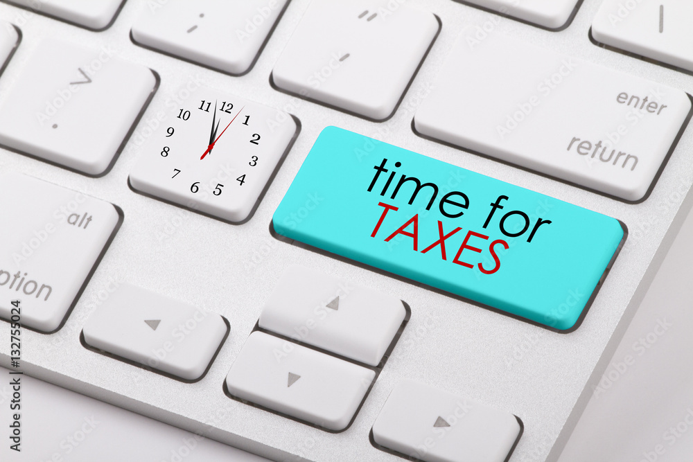 Time for taxes written on computer keyboard. Time for taxes written on computer keyboard.