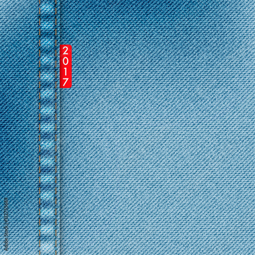Light blue jeans texture. Denim background with red label and text 2017