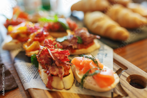 Classic Spanish tapas cooked for the visitors of the event on a wooden board.