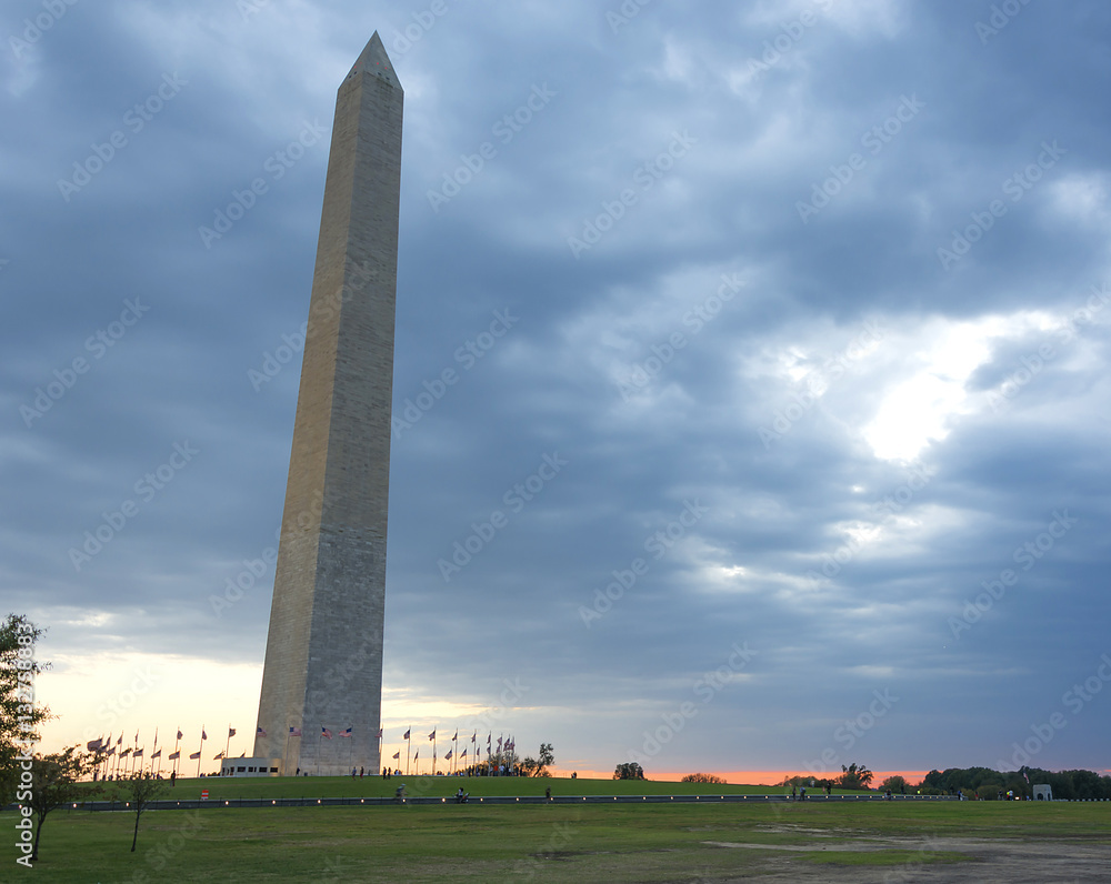 Washington Monument at sunset with heavy clouds