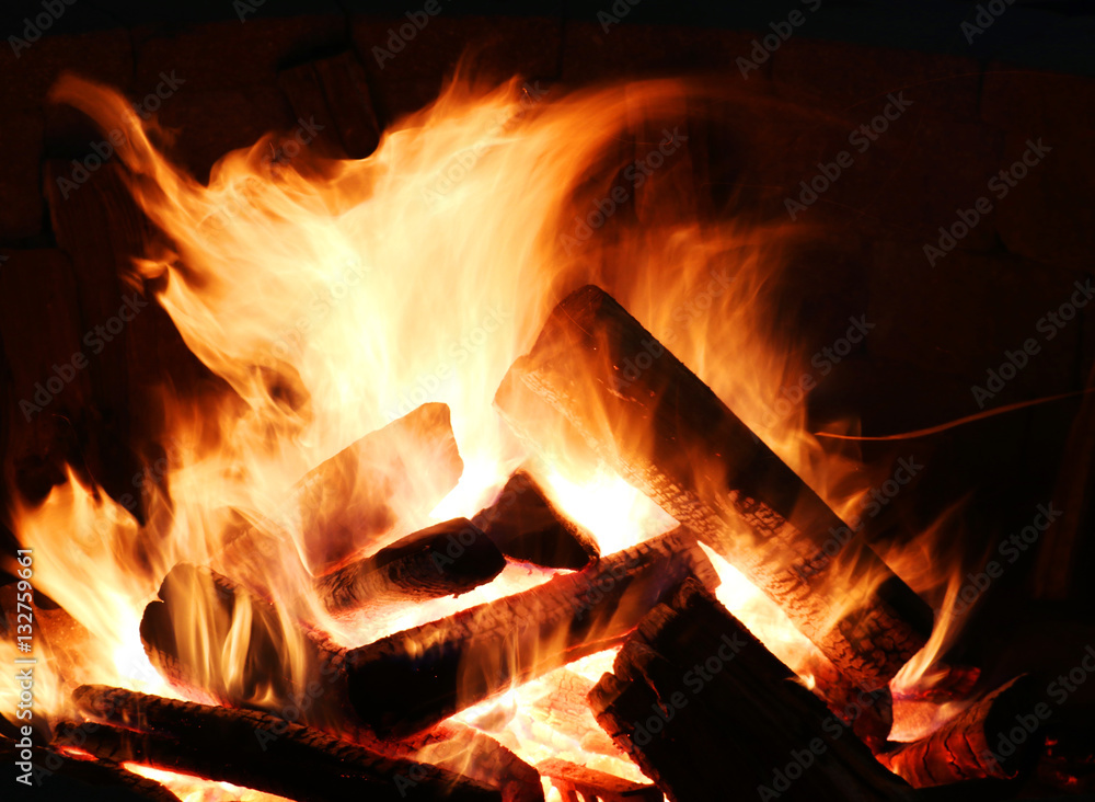 Bonfire flame. A fire burns in a fireplace close up. Bonfire flame. A fire burns in a fireplace close up.