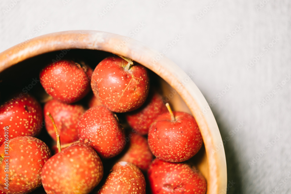 maybush in wooden bowl