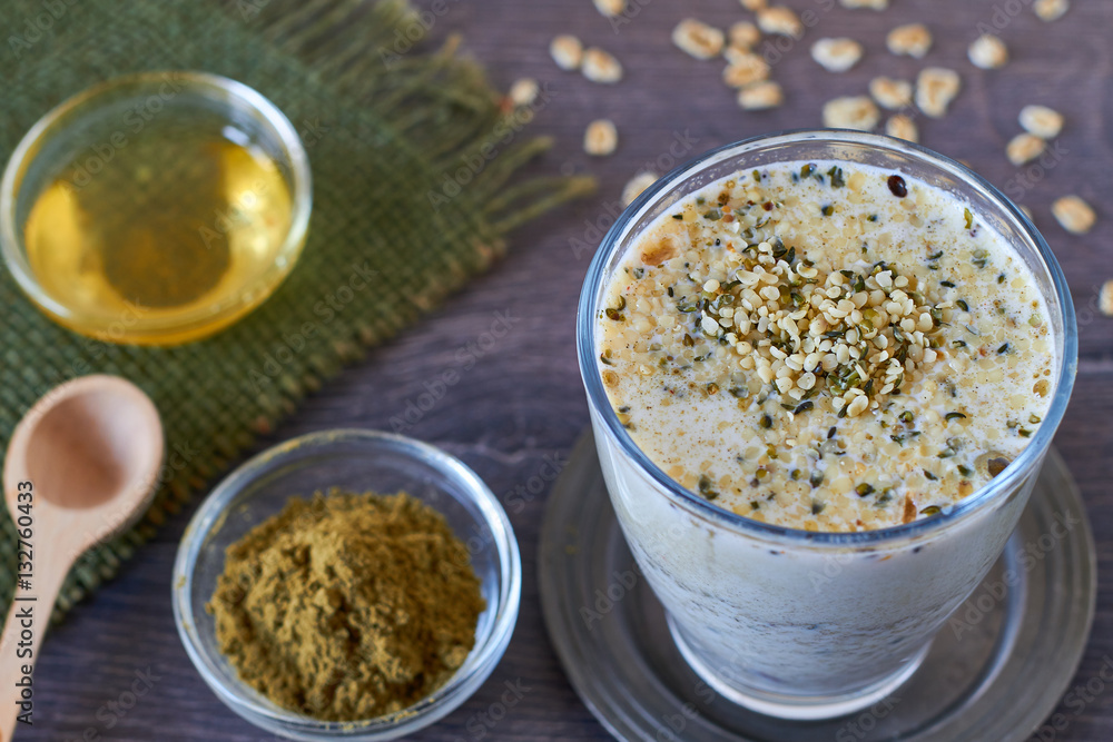 Homemade smoothie made from oats milk, shelled hemp and honey Homemade smoothie made from oats milk, shelled hemp and honey