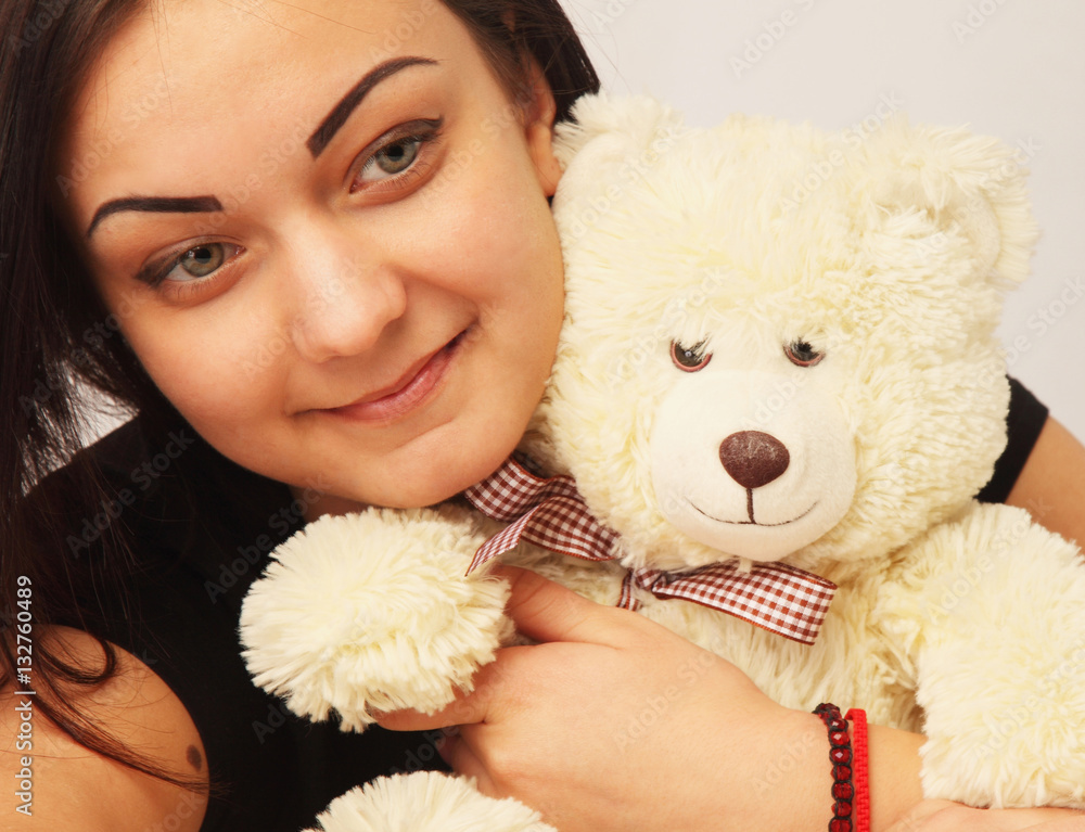 beautiful woman with Bear toy as a symbol of happy childhood beautiful woman with Bear toy as a symbol of happy childhood