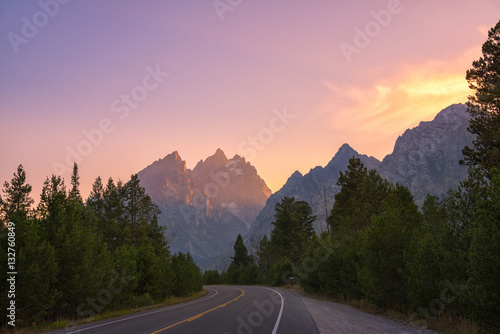 Road thru Grand Teton National Park during a sunset 