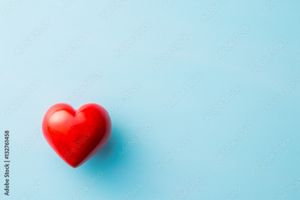 Red heart on blue background.