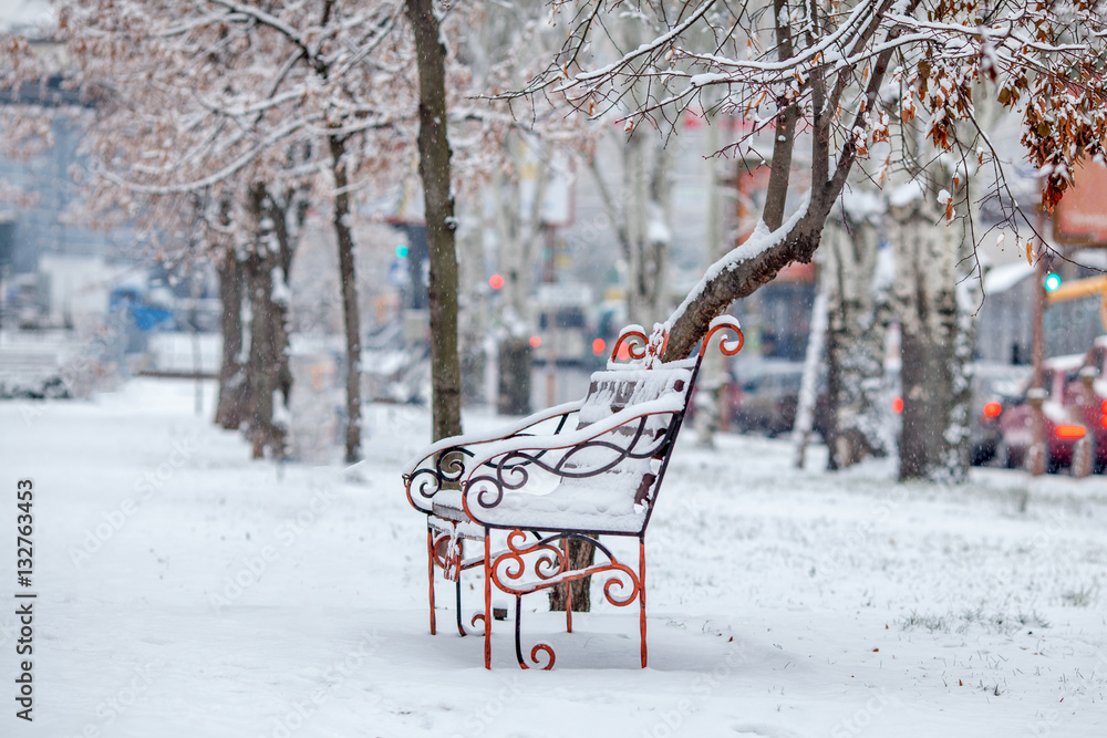 bench in snowy Park