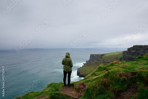 Person standing looking out at 