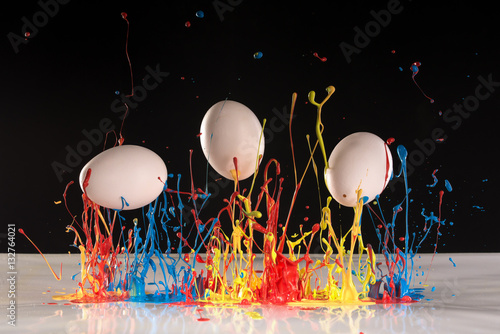 Easter eggs painted with coloured splash paint