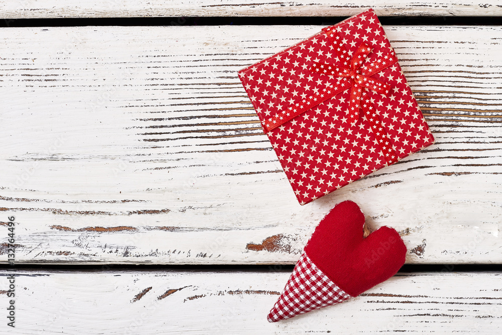 Obraz premium Fabric heart near gift box. Present wrap with star pattern. Interesting idea for greeting.