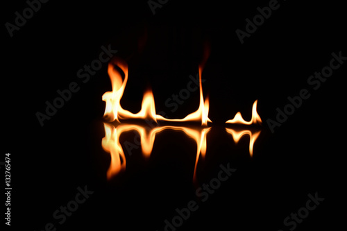   flames on a black background with mirror reflection