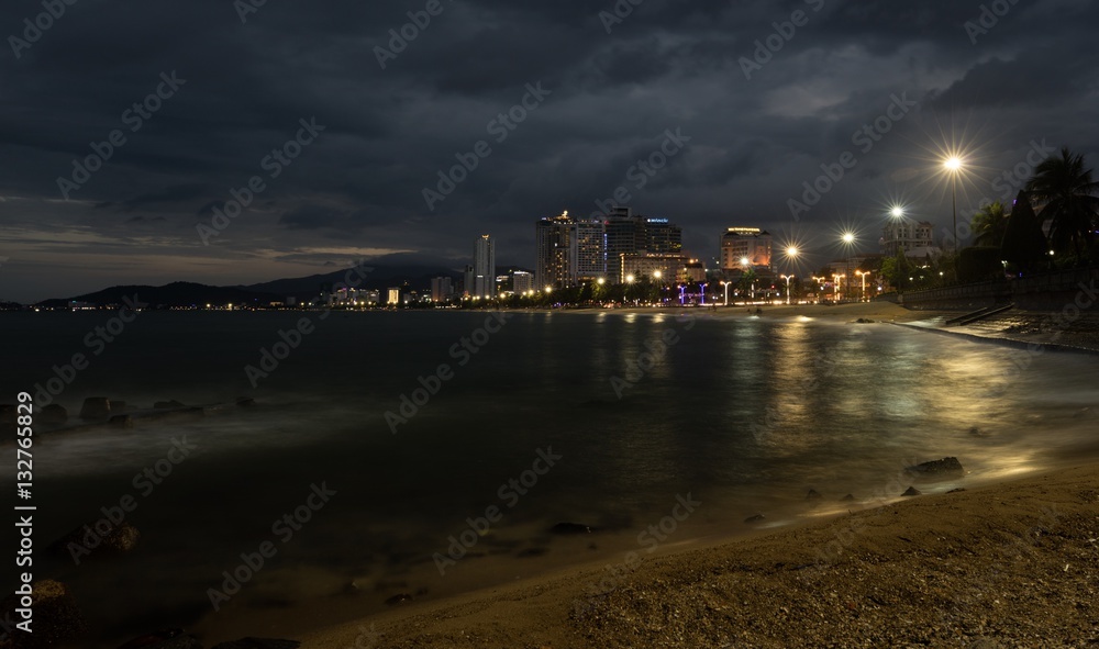 Nha Trang holiday resort skyline Vietnam slow exposure just after sunset with the city lights ablaze.