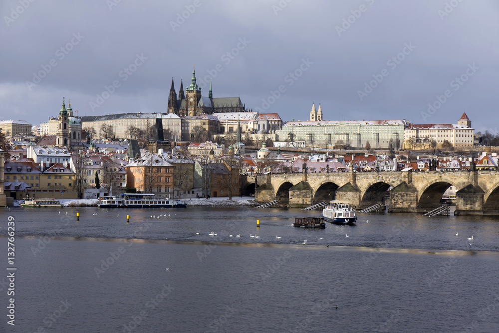 Snowy freeze Prague Lesser Town with gothic Castle and Charles Bridge, Czech republic