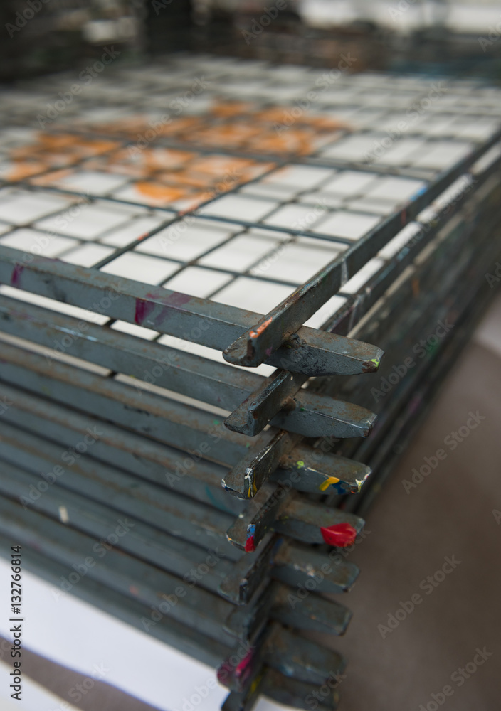Metal screen printing drying rack with a shallow depth of field