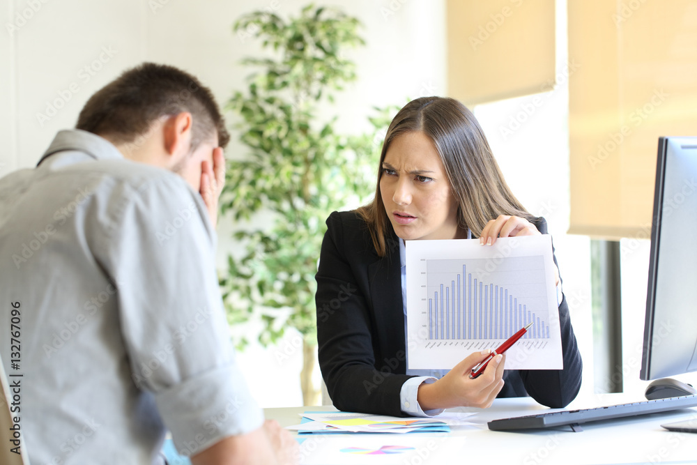Angry boss scolding to an employee Angry boss scolding to an employee