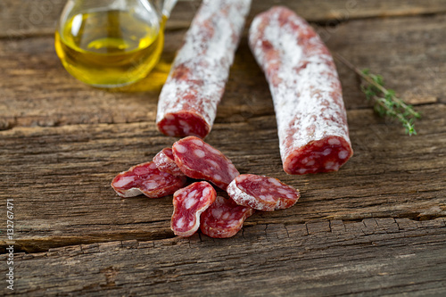 Typical traditional spanish salamis on wooden surface