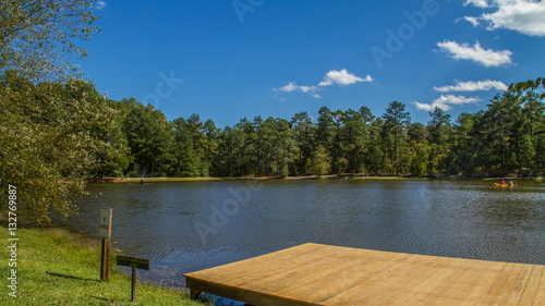 Fishing Pier at Calm Lake on a Summer Afternoon