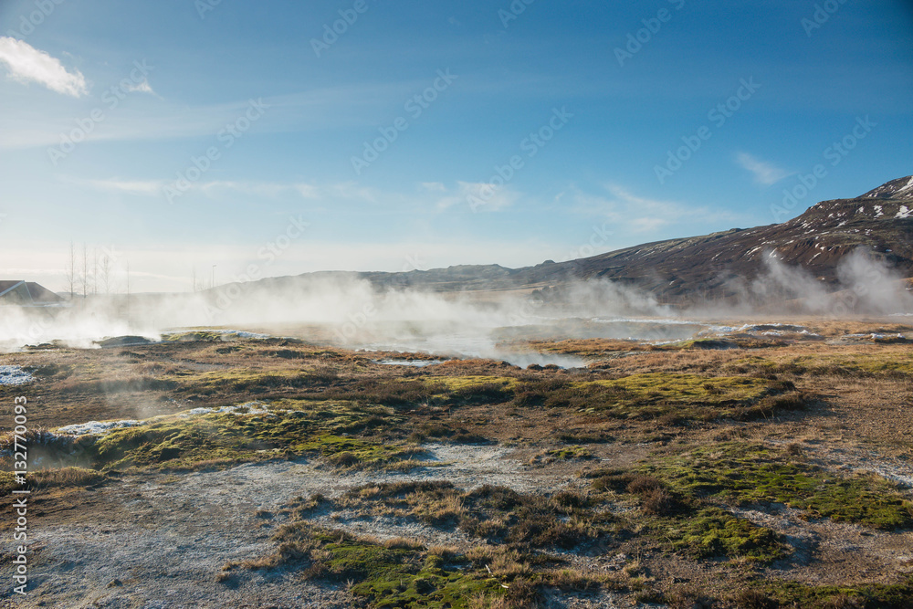 Iceland geothermal field with steam hot pots with geysers 
