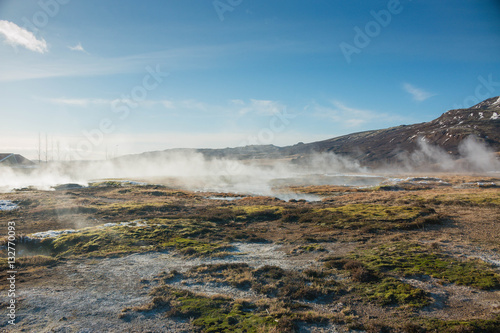 Iceland geothermal field with steam hot pots with geysers 