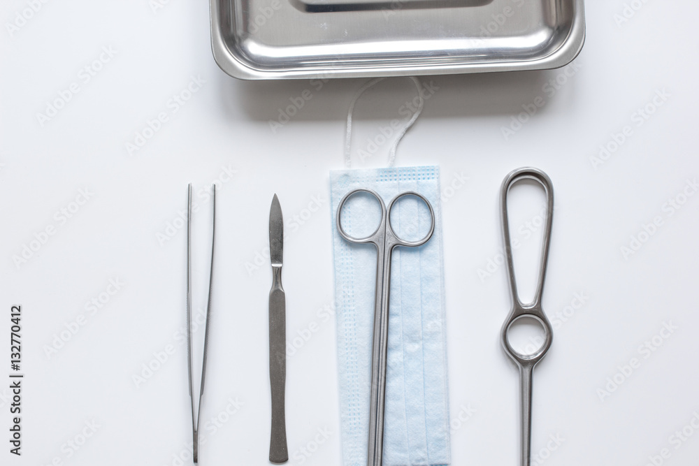 instruments for plastic surgery on white background top view instruments for plastic surgery on white background top view