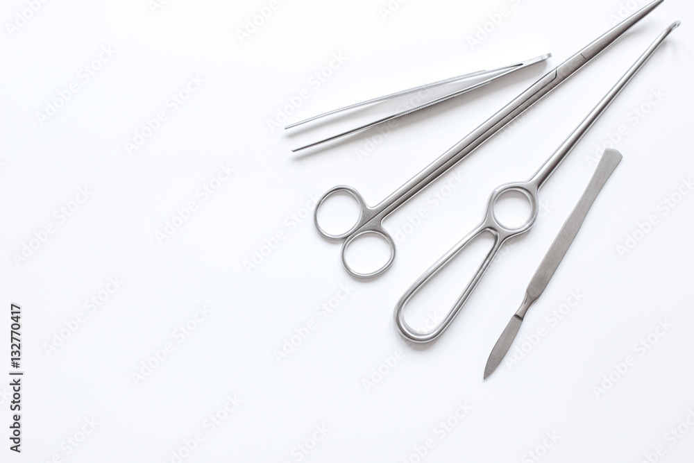 instruments for plastic surgery on white background top view instruments for plastic surgery on white background top view
